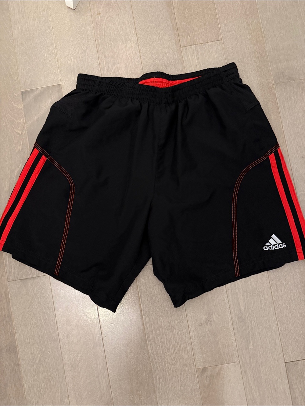 adidas Black Athletic Shorts with Red Stripe Accents